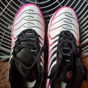 White and Pink Athletic Shoes with Streamlined Design